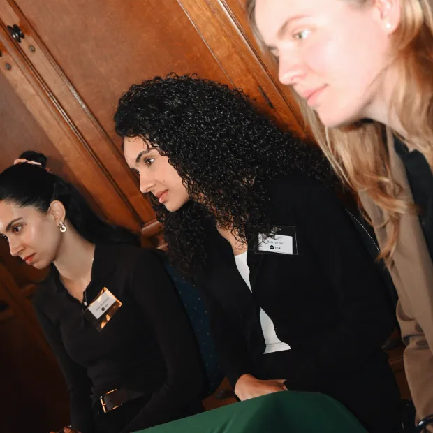 Aida van Riel listening to a presentation at an ISPOR session